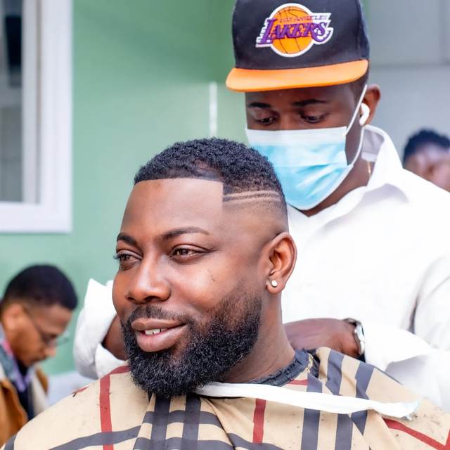 Barber and client during an edge-up